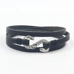 Vintage punk black leather wrap bracelet featuring an antique silver snake S-shaped buckle