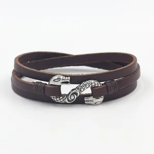 Retro double-layer brown leather bracelet featuring a silver metal twin snake buckle