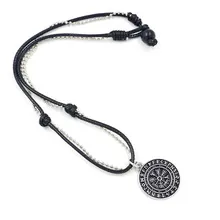 Close-up of Viking Vegvisir compass pendant with Nordic runes on black adjustable leather cord
