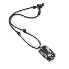 Close-up of woven leather rope and bead chain with silver skull wing pendant