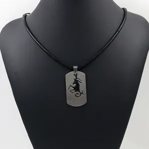 Collana da uomo con pendente bicolore Capricorno in acciaio e cordino nero intrecciato