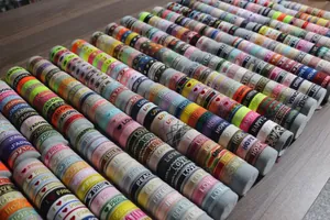 Macro detail of colorful embroidered textile bracelets with various patterns and words