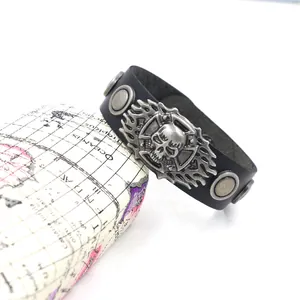 Retro punk wide black leather bracelet with silver skull emblem and metal rivets