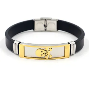 Bracciale punk da uomo in silicone nero con teschio dorato e chiusura in acciaio