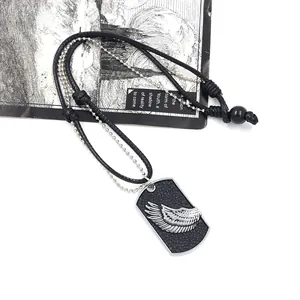 Men's punk style dog tag necklace featuring a silver wing relief on black textured base
