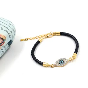 Bracelet tressé en cuir avec œil porte-bonheur serti de cristaux et fermoir doré