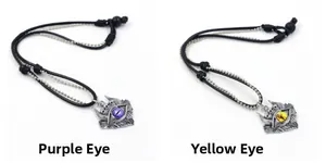 Detail of punk devil eye pendants with silver horns and skulls in purple and yellow
