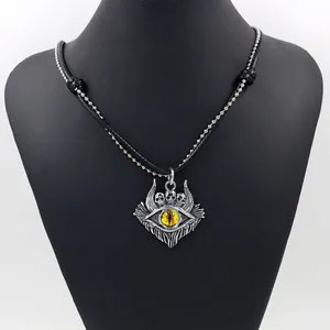 Detail of gothic devil eye skull pendant with silver alloy finish and double layer chains