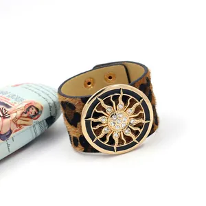 Leopard print faux fur wide leather cuff bracelet with gold sun crystal embellishment