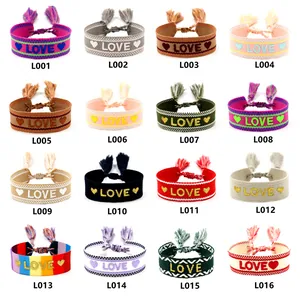 Detailed display of 16 woven friendship bracelets with LOVE patterns and tassels