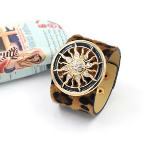 Leopard print faux fur wide leather cuff bracelet with sunburst rhinestone emblem
