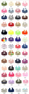 Detailed grid showing 52 colorful ethnic woven bracelets with braided tassels and patterns