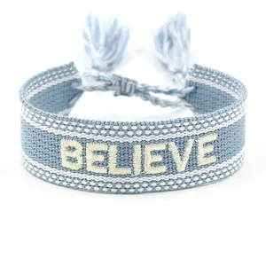 Γαλάζιο υφαντό βραχιόλι φιλίας με κέντημα BELIEVE και διακοσμητικά κρόσσια φούντες