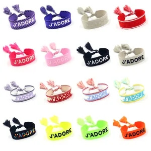 Adjustable woven friendship bracelets with letter embroidery and colorful tassel details