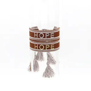 Bracelet tissé de style ethnique avec inscription HOPE en perles et détails de franges