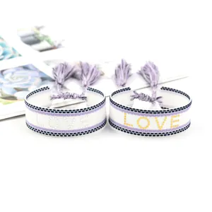 Adjustable woven LOVE bracelets set with purple tassels and stylish bohemian pattern