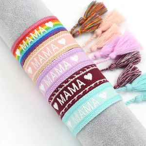 Handmade woven friendship bracelets with MAMA embroidery and colorful cotton tassels