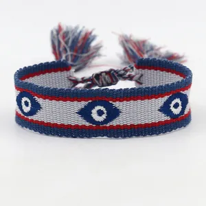 Handgeweven boze oog armband met blauwe strepen en verstelbare kwastjes sluiting