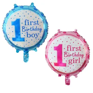 Detail view of pink and blue first birthday foil balloons with polka dot patterns