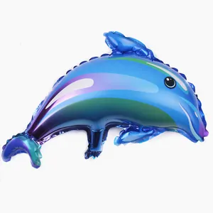 Detail of a blue dolphin foil balloon with vibrant purple and green gradient patterns