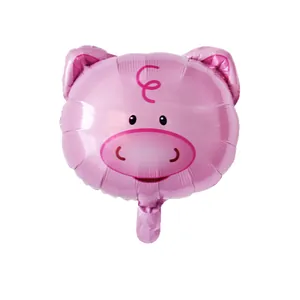 Pink cartoon pig head shaped foil balloon with reflective finish on white background