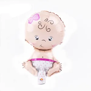 Detail view of baby girl aluminum foil balloon with pink bow and heart diaper pattern