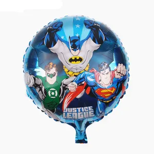 Detailed close-up of blue round foil balloon featuring Superman and Batman graphics