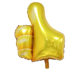 Large golden thumbs up foil balloon with metallic finish for wedding or party decoration