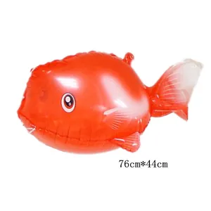 Detailed view of red fish-shaped foil balloon measuring 76cm by 44cm for party decor