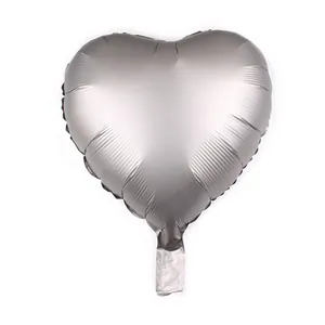 Close-up of 18 inch heart-shaped silver foil balloon with matte metallic finish