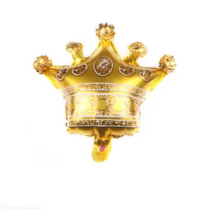 Detail view of mini gold crown aluminum foil balloon with shimmering decorative patterns