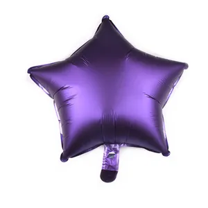 Detailed close-up of matte dark purple star-shaped foil balloon with metallic texture