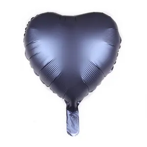 Close-up of 18-inch heart-shaped balloon with matte black metallic foil texture