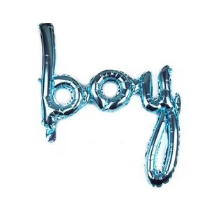 Close-up of metallic blue boy script foil balloon for birthday party decorations