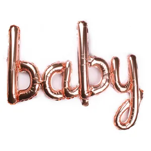 Detail of rose gold cursive 'baby' foil balloon for baby shower party decorations
