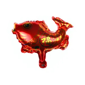 Detail of red koi fish foil balloon with golden scales and festive Fu character