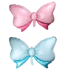 Détails des ballons en aluminium en forme de nœud à pois roses et bleu ciel