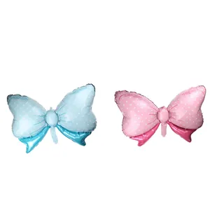 Lot de ballons en forme de nœud rose et bleu avec pois blancs et fini brillant