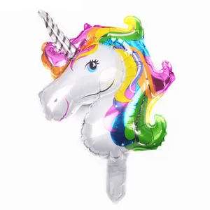 Detail view of unicorn aluminum foil balloon showing colorful gradient texture and star patterns