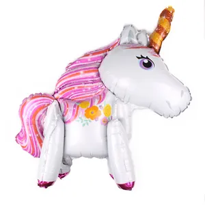 Detail of 3D rainbow unicorn balloon with pink mane and golden spiral horn