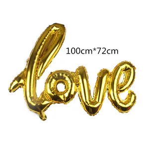 Detail of 100x72cm gold foil Love balloon showing metallic texture for wedding decor