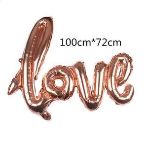 Macro detail of rose gold Love foil balloon showing 100cm by 72cm dimensions