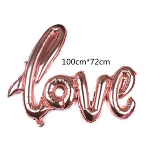 Detailed view of rose gold Love cursive foil balloon with size dimensions 100cm by 72cm