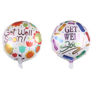 Detail of round foil balloons with colorful flowers, bandages, and Get Well Soon text
