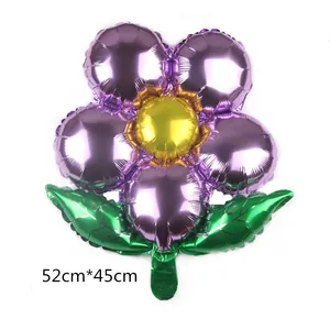 Detailed view of sun flower foil balloon with purple petals and green leaves, 52x45cm