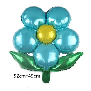 Detail view of sunflower foil balloon with blue petals and green leaves, size 52x45cm