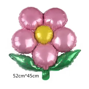 Detailed view of sun flower foil balloon with pink petals and green leaves, 52x45cm size