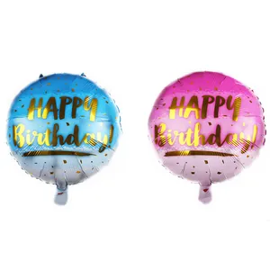 Detail of pink and blue gradient round foil balloons with golden Happy Birthday text