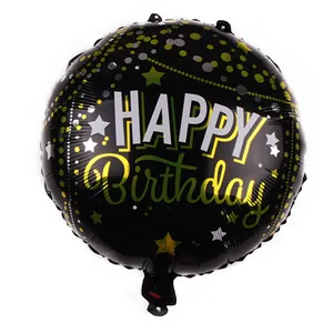 Detail of 18-inch black foil birthday balloon with gold polka dots and silver stars