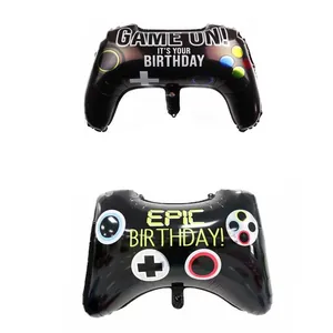 Close-up of black game controller foil balloons with Game On and Epic Birthday prints